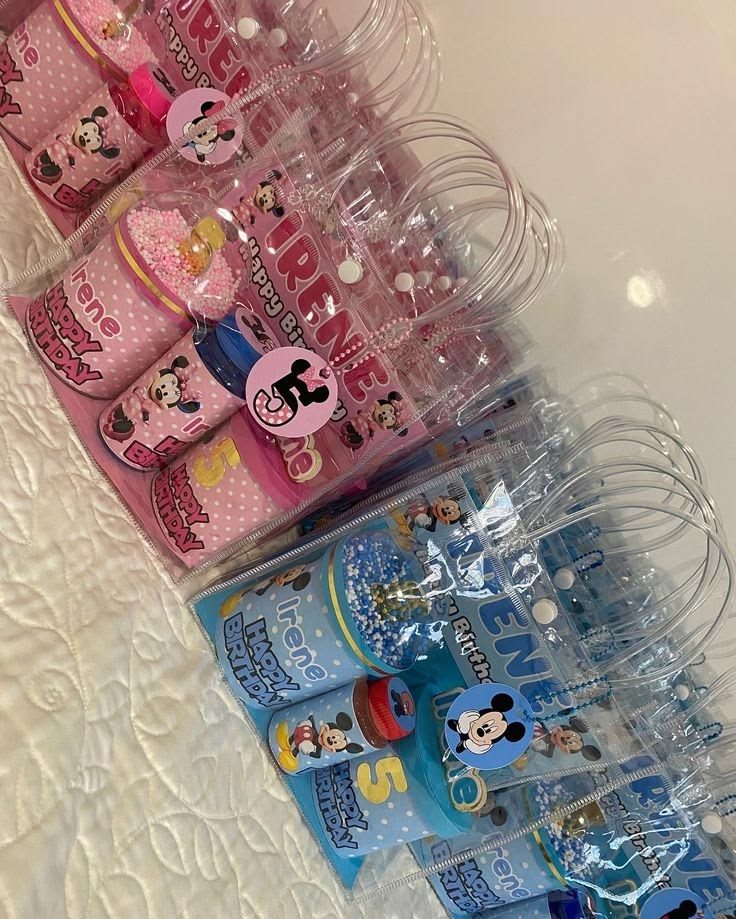 Pink and blue clubhouse mouse themed gift bags with chip bags and cups